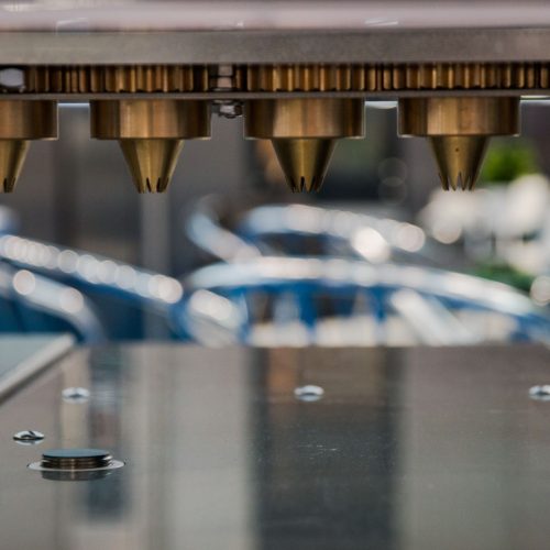 Industrial equipment stacking dough blanks for biscuit production