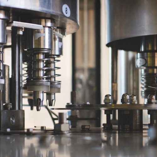 Industrial machinery in a production line with stainless steel factory equipment and automation