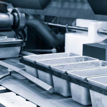 Industrial production of bakery products on an assembly line using technology and machinery in a food factory