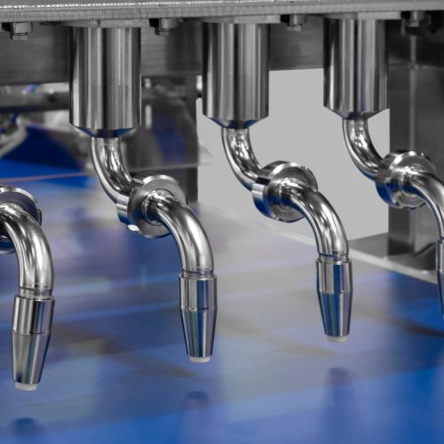 Industrial production of bakery products on an assembly line using food factory machinery